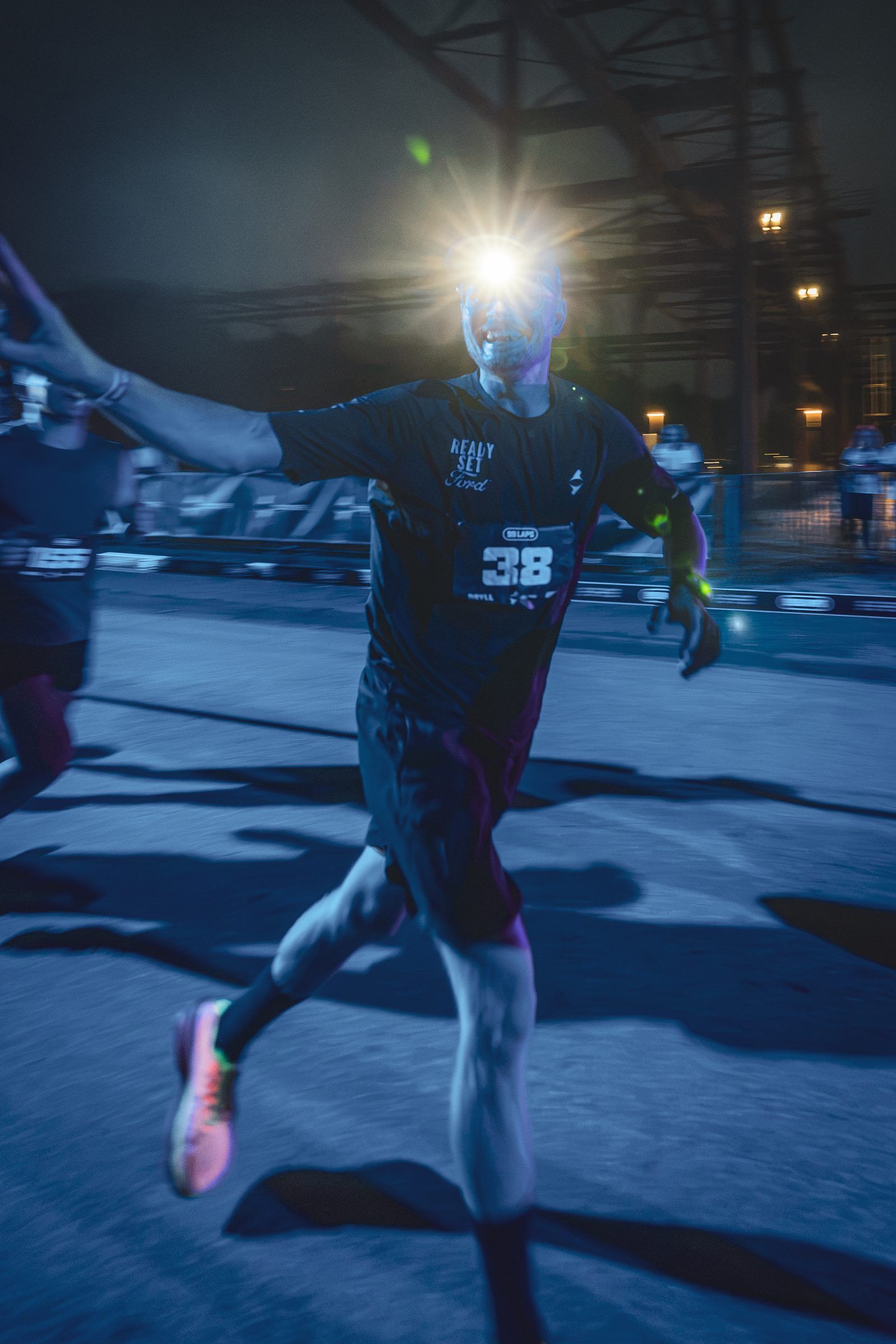 Pierre running at night with a headlamp