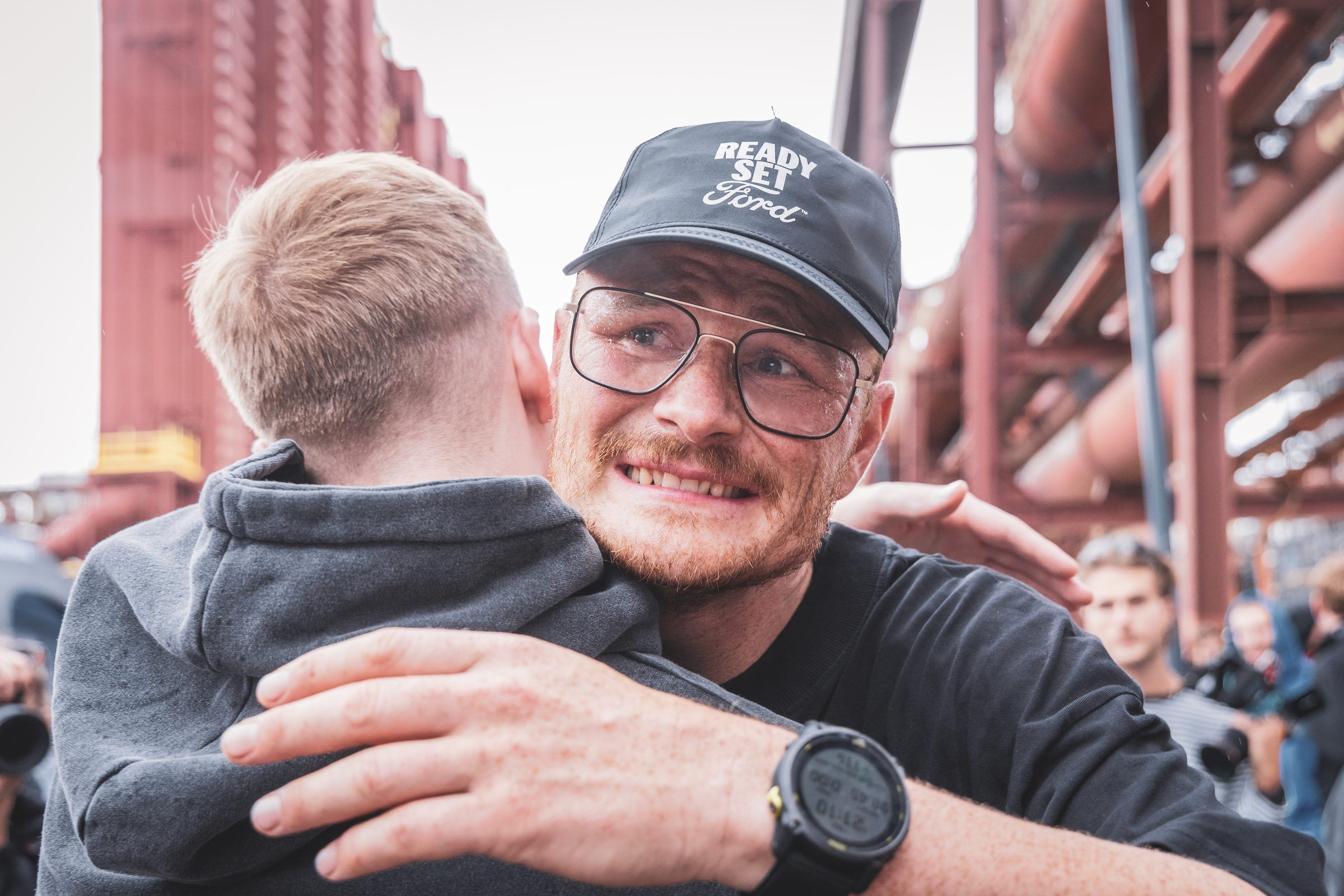 Pierre hugging a friend after the race
